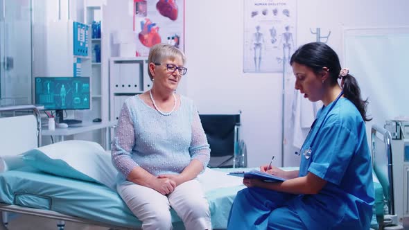 Discussion with Nurse in Modern Hospital