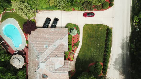 luxury car parking at a luxury residential house with personal swimming pool cinematic aerial view i