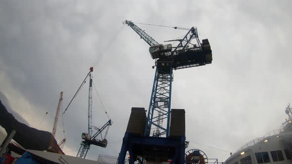 Construction crane at Westcon yards Olensvaag Norway silhouette