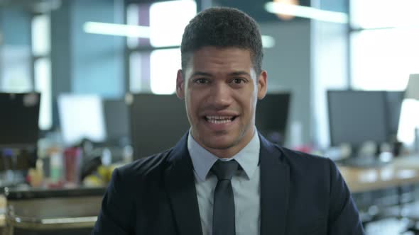 Portrait of African Businessman Screaming in Modern Office