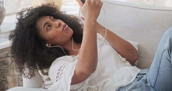 Female Black Student Sitting on Sofa and Making Video Call