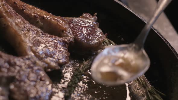 Onions are Thrown to the Сastiron Pan Fried in Butter