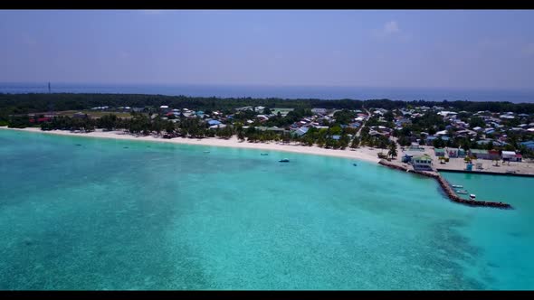Aerial view scenery of idyllic seashore beach adventure by aqua blue water and white sand background