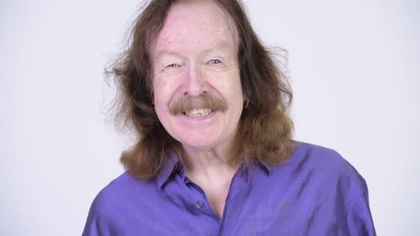 Happy Senior Man with Mustache Wearing Purple Silky Shirt