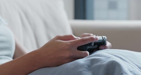 Woman play tv game at home