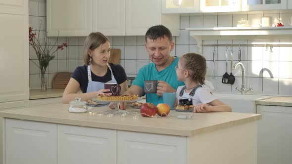 Loving Family Enjoying Having Breakfast Together