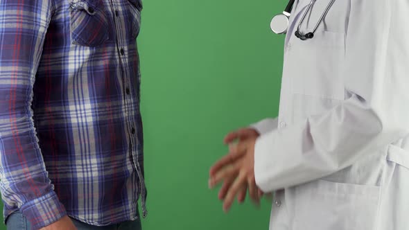 Doctor Shaking Hands with His Patient on Chromakey