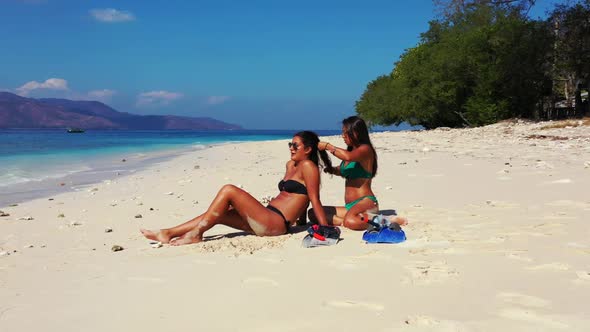 Female models tanning on exotic sea view beach vacation by clear ocean and white sand background of 