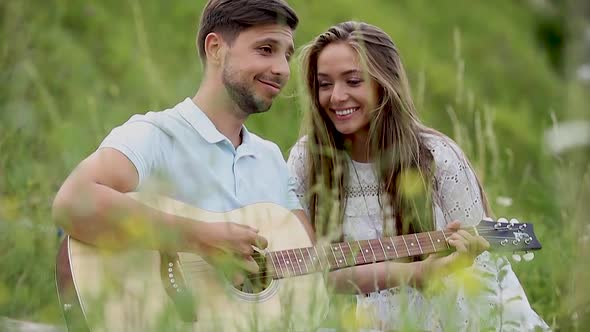 Young Couple In Love On Date Outdoors