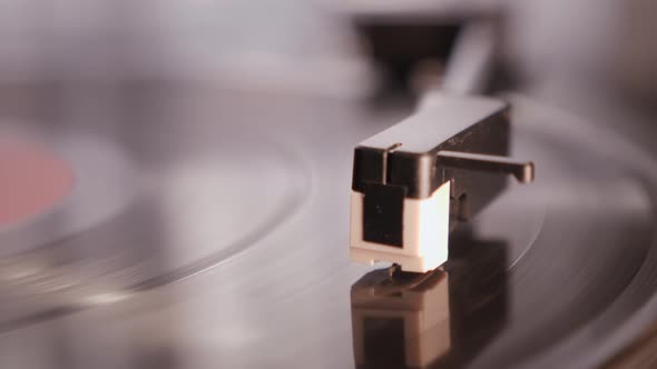Turntable tonearm play vinyl record.
