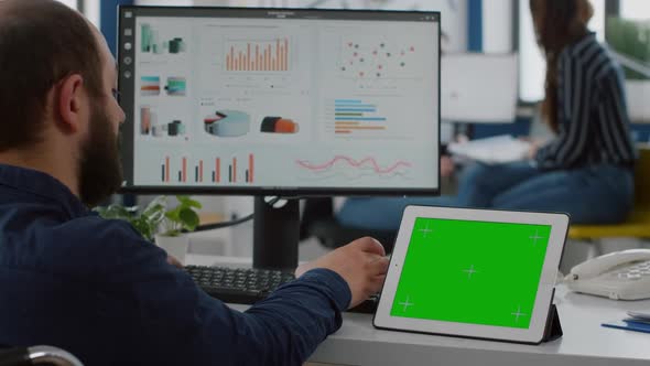 Paralyzed Manager Analysing Statistics Looking at Tablet with Izolated Display