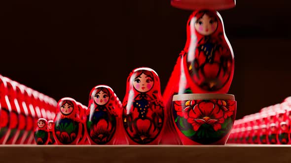 Beautiful handmade matryoshka dolls. Placing one of babushka inside others.