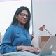 Close up of a young indian woman typing on computer - VideoHive Item for Sale