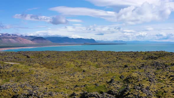 Iceland. Aerial view on the coast line, mountains and ocean. Beach and sea from air