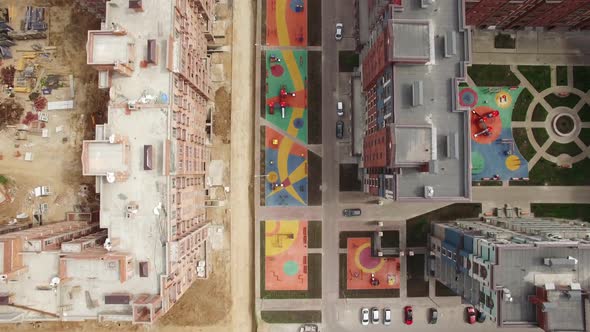 Flying Over New-built House and Apartment Block Under Construction, Russia alt