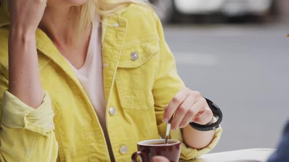 Side view of Caucasian woman enjoying at terrace coffee