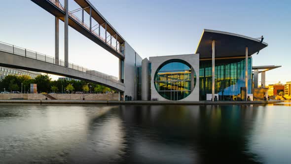 Night to Day Sunrise of Berlin government district with reflections on Spree river, Berlin, Germany