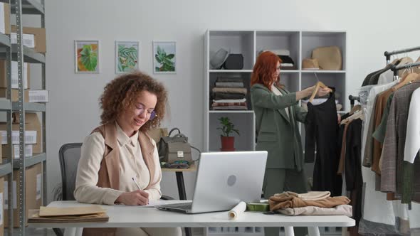 Successful Business Young Female Entrepreneur and Her Colleague Celebrate Online Sales and Give Each