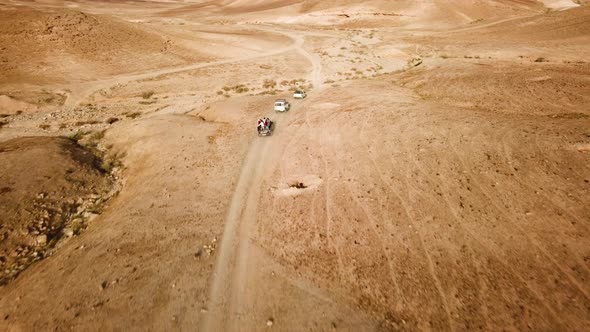 A group of travelers going through the Desert