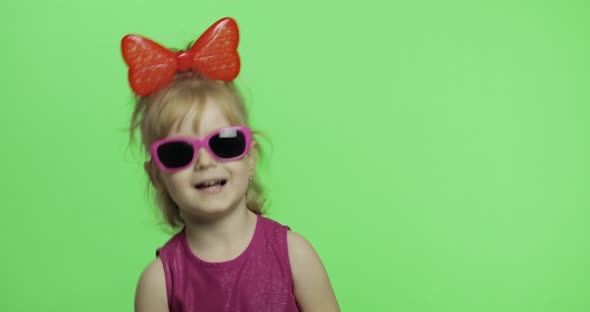 Girl in Purple Dress. Dancing and Shows a Finger Forward. Chroma Key