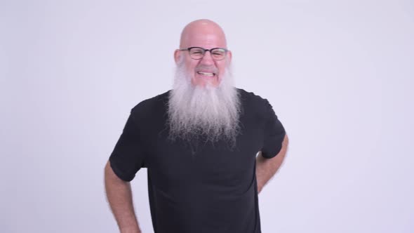 Stressed Mature Bald Bearded Man Having Back Pain
