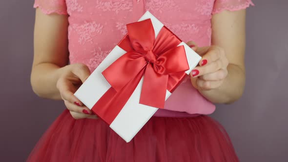 Hands are holding gift box for Valentines Day