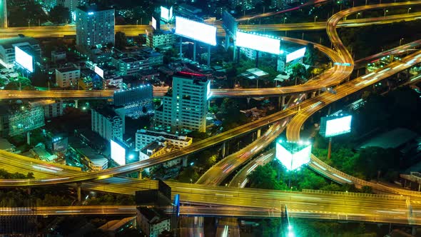 road junction in the city at night. traffic on the road, light from cars, lines of lights alt