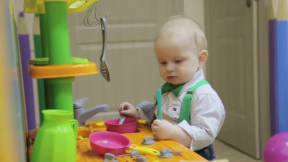 Happy Mother with Her Son Having Fun in the Kitchen