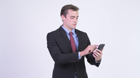 Young Happy Handsome Businessman Using Phone