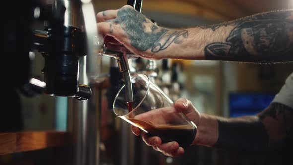 Barman Pouring Nitrogen Beer Into Glass Closeup