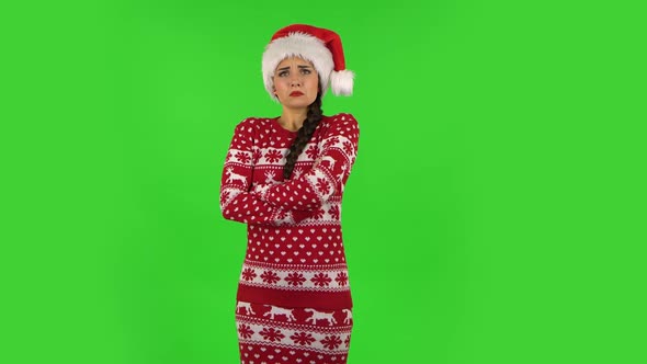 Sweety Girl in Santa Claus Hat Is Very Offended and Looking Away. Green Screen