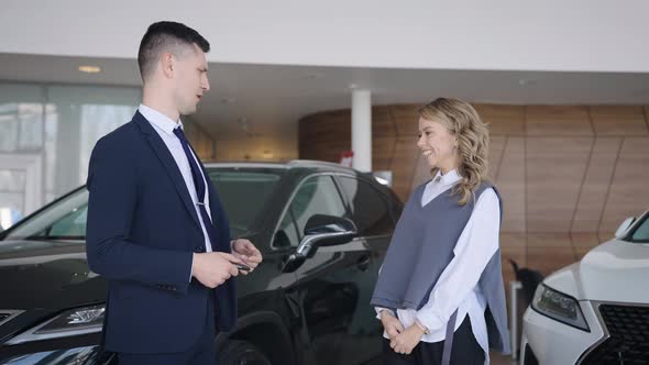 The Woman is Jumping for Joy She Bought the Car of Her Dreams