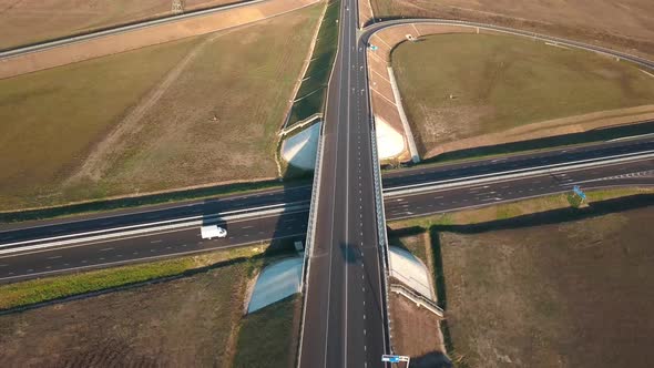 Top View of Road and Bridge with Moving Cars