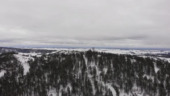 Wilderness Firetower on top of a mountain in the snow