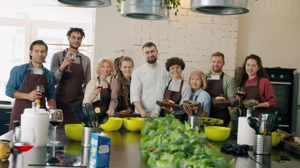 Portrait of Happy Men and Women Cooking School Students Smiling Holding Food and Drinks