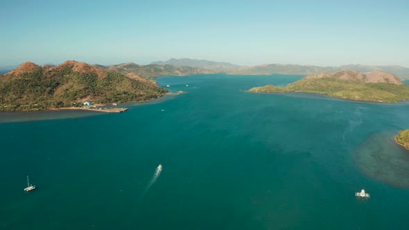 Tourist Boats in a Bay with Blue Water