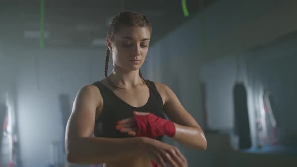 Slow Motion Woman Fighter Wraps Her Hands with Boxing Bandages Kickboxing Training Day in a Gym
