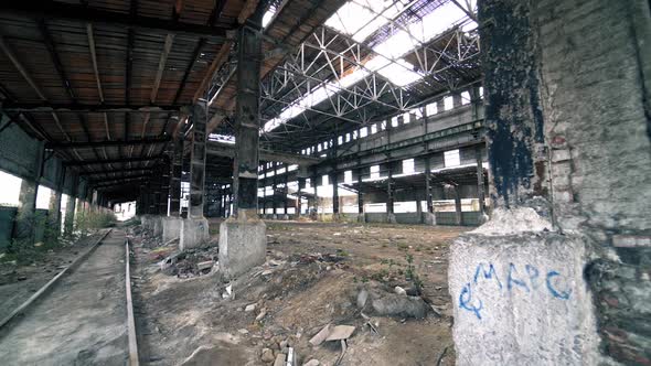 Abandoned and haunted industrial creepy warehouse inside. Old ruined factory building.