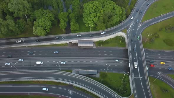 Aerial View Flying Over of Loaded Cars with Traffic Jam at Rush Hour on Highway with Bridge