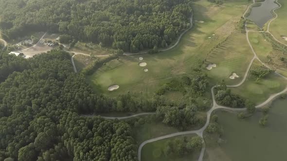 Aerial View of Large Luxury Golf Course. View of the Green Lawns and Trees. Shooting From Above, Top