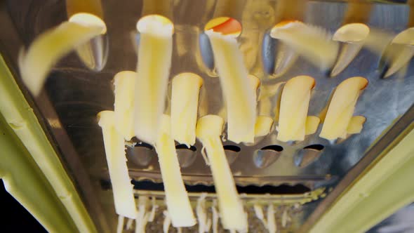 Close Up Grated Cheese Macro Shot Frame Inside Metal Grater