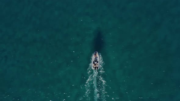 Overhead Top Down Birds Aerial View of Small Boat on Crystal Clear Turquoise Water