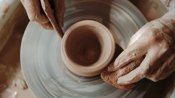 The Potter's Woman Hands Are Shaped a Cup From a Clay. The Process of Creating Pottery. The Master