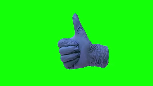 Doctors Hand in Blue Glove Is Holding Thumb Up Making Gestures Like. Green Screen. Close Up