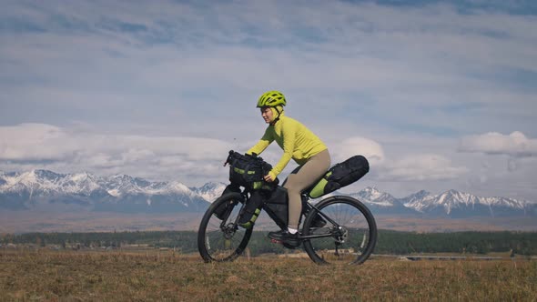 The Man and Woman Travel on Mixed Terrain Cycle Touring with Bikepacking