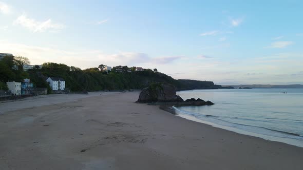 Tenby North empty Beach, Pembrokeshire in Wales. Aerial forward ascending