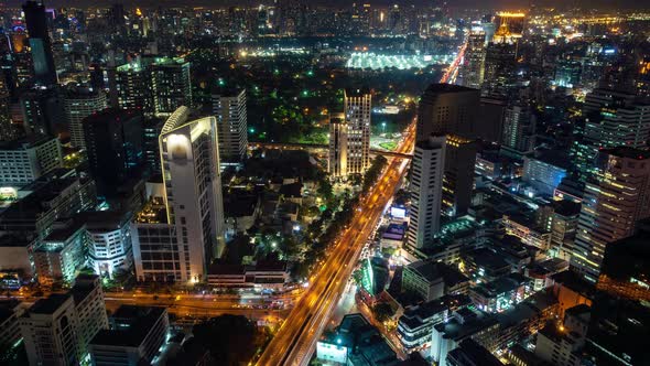 Bangkok business district city center, traffic at night during rush hour, zoom in – Time Lapse
