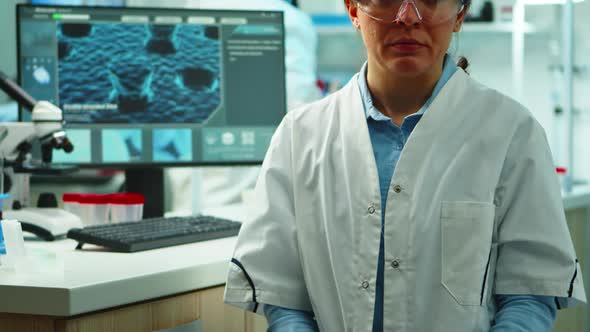 Close Up of Scientist Nurse Looking Tired at Camera