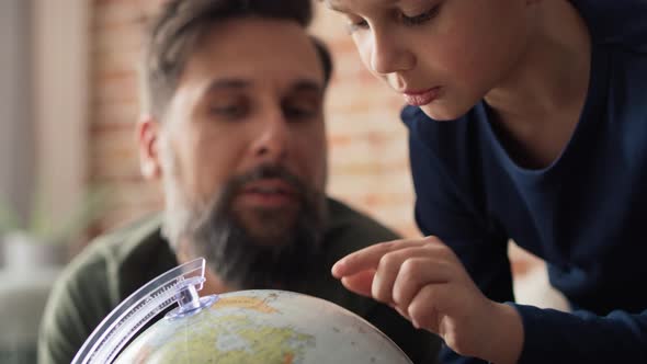 Video of father and son looking for a travel plan. Shot with RED helium camera in 8K.