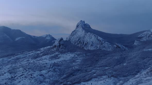 The Icy Landscape of Cold Harsh Mountains Aerial Drone Shot